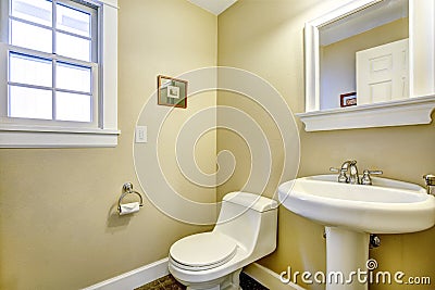 Light yellow bathroom with window Stock Photo