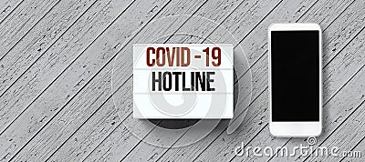 Lightbox with text COVID-19 HOTLINE and empty line for telephone number Stock Photo