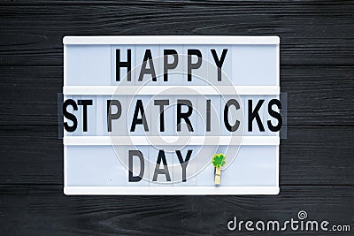 Lightbox with title Happy st Patrick Day on black wooden background. Creative background Stock Photo