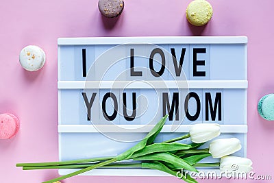 Lightbox with title I love you mom on white wooden table. Mothers day Stock Photo