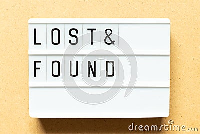 Light box with word lost & found on wood background Stock Photo