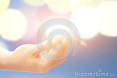 Lightbulb glowing with bright light,illuminates background with circular lights Stock Photo