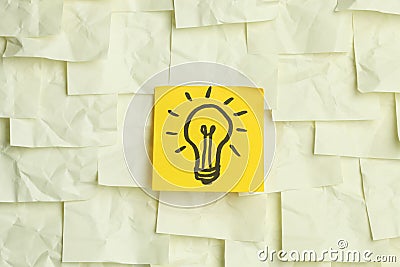 Lightbulb on sticky notes Stock Photo