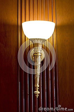 Lighted classic sconce on the wall Stock Photo