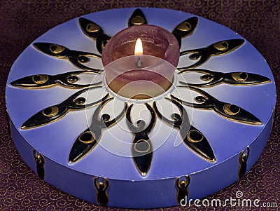 Lighted Decorative Candle with Twelve Goddesses Stock Photo