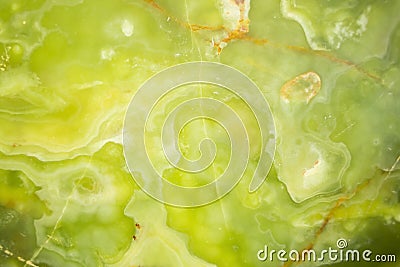 Lightened slices marble onyx. Horizontal image. Warm green colors. Beautiful close up background Stock Photo