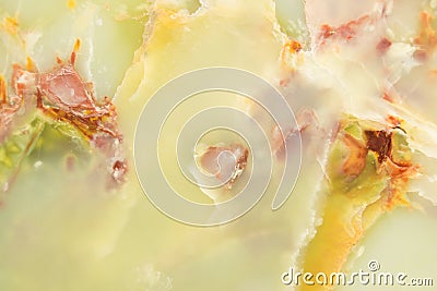 Lightened slices marble onyx. Horizontal image. Warm green colors. Beautiful close up background Stock Photo