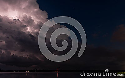 Lightening Brights Up Cloud in Night Storm Stock Photo