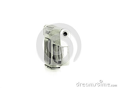 Lighter in the form of a gun on a light background. Toned Stock Photo