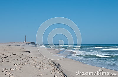 Lighthouse and Beach Stock Photo