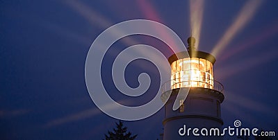 Lighthouse Beams Illumination Into Rain Storm Maritime Nautical Stock Photo