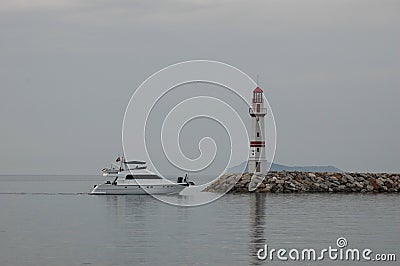 Lighthouse and boat. Stock Photo