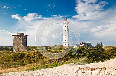 Lighthouse and bunker in the sand dunes on the beach of Blavand, Jutland Denmark Europe Stock Photo