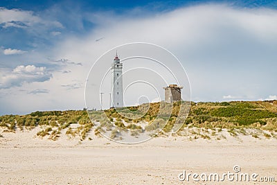 Lighthouse and bunker in the sand dunes on the beach of Blavand, Jutland Denmark Europe Stock Photo