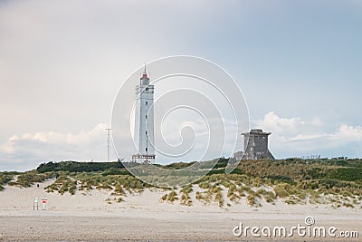 Lighthouse and bunker in the sand dunes on the beach of Blavand, Jutland Denmark Europe Stock Photo