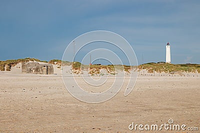 Lighthouse and bunker in the sand dunes on the beach of Blavand, Jutland Denmark Europe Stock Photo