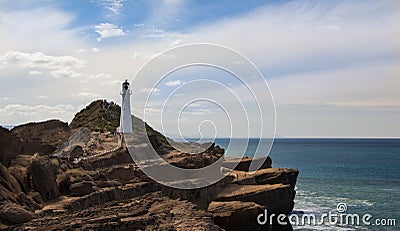 Castlepoint Lighthouse On Rocks Stock Photo