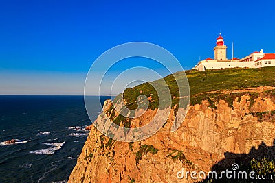 Lighthouse on the cliff at Cabo da Roca. Cabo da Roca or Cape Roca is westernmost cape of mainland Portugal, continental Europe Stock Photo