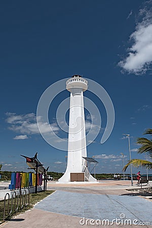 Lighthouse with colored lettering of tourist resort with marlin fish in Mahahual, Mexico Editorial Stock Photo