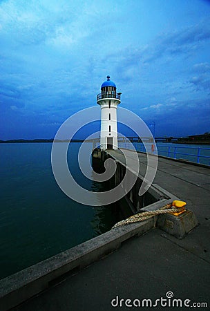 Lighthouse in the Dusk Stock Photo