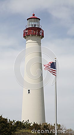 Lighthouse with flag Stock Photo