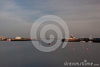Lighthouse at Howth port. Howth is a fishing small port near Dublin Bay. Editorial Stock Photo
