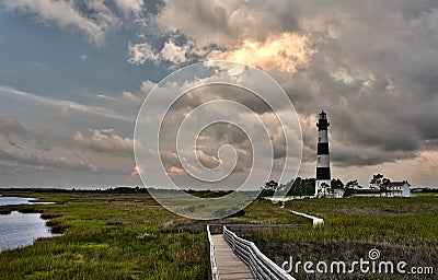 Lighthouse and incoming stormclouds Stock Photo