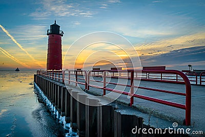 Lighthouse on Lake Michigan at sunrise Stock Photo