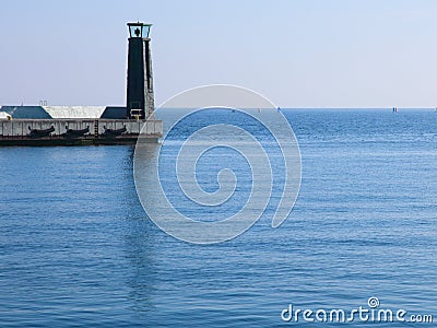 Lighthouse lamp post breakwater, port detail Stock Photo