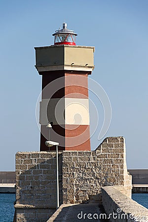 Lighthouse in Monopoli port, Adriatic Sea, Apulia, Bari province, Italy Stock Photo