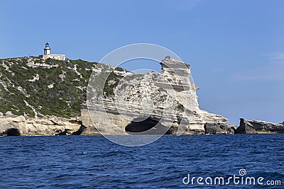 Lighthouse Pertusato overlooks a famous rock, Coast of Bonifacio, Corsica Stock Photo