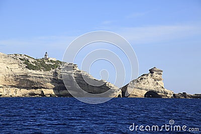 Lighthouse Pertusato overlooks a famous rock, Coast of Bonifacio, Corsica Stock Photo