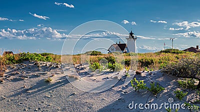 Lighthouse Point on beach dunes. Stock Photo