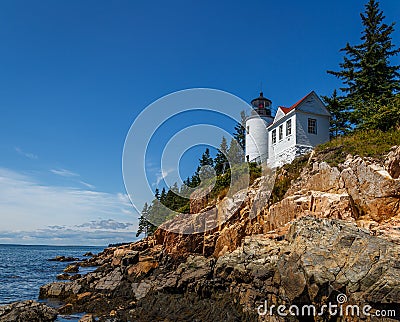 White Lighthouse on Rocky Maine Coast Stock Photo