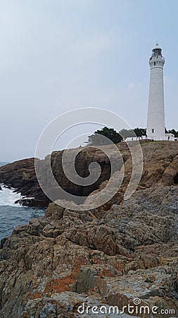 Lighthouse on the rocky shore of the Sea of Japan. Matsue, Shimane, Japan Stock Photo