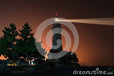 Lighthouse searchlight. Night marine embankment of Weihai Stock Photo