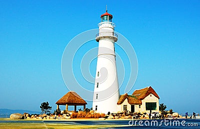 Lighthouse in seashore Stock Photo