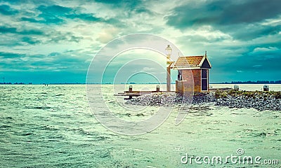 Lighthouse on shore sea with lighting lantern Stock Photo