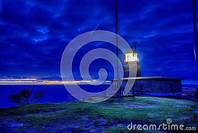 Lighthouse at sunset Stock Photo