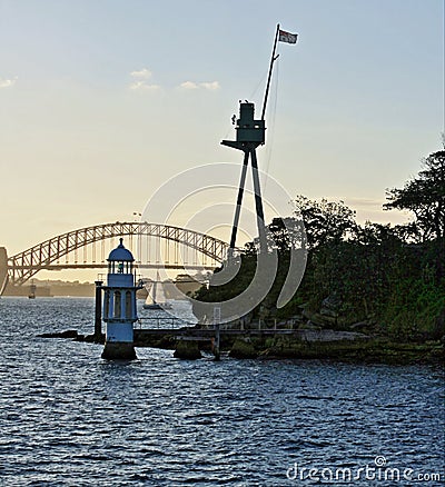 Lighthouse in Sydney Harbor near The Coathanger bridge Stock Photo