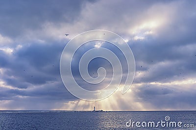 Lighthouse under the sun in the winter Stock Photo