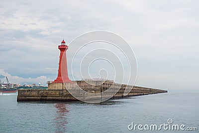 Lighthouse under sunburst Stock Photo