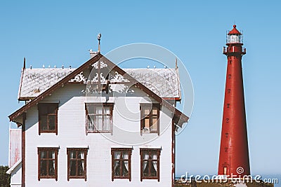 Lighthouse and white wooden old house in Norway traditional architecture Stock Photo