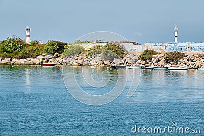 Lighthouses and fishing boats at Akcakoca harbor in Duzce province, Turkey Stock Photo