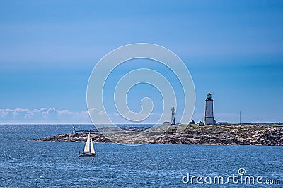 Lighthouses and sailboat on an archipelago island in Norway Editorial Stock Photo