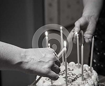 Lighting birthday candles Stock Photo