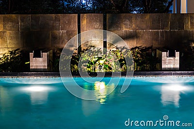 Lighting business for luxury backyard swimming pool. Relaxed lifestyle with contemporary design by professionals. Stock Photo