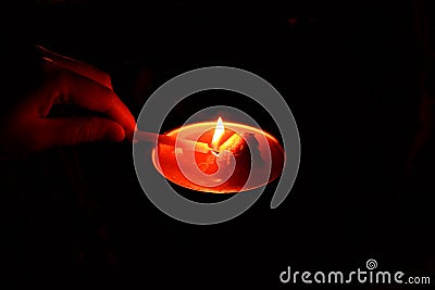 Lighting the candle for pray Stock Photo