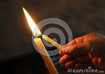 Lighting the candle for pray Stock Photo