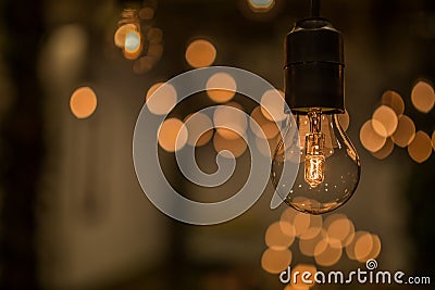 Lighting decor. Retro light bulb filament close up.Illuminated. Stock Photo